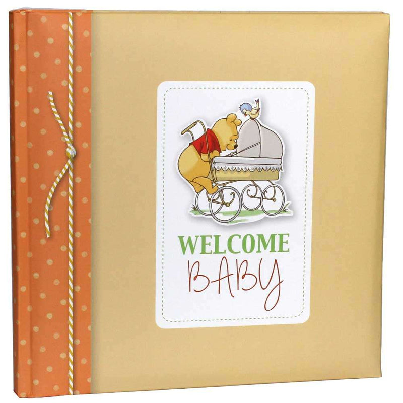 Baby album with Winnie the Pooh design and 'Welcome Baby' text on a beige and orange cover.