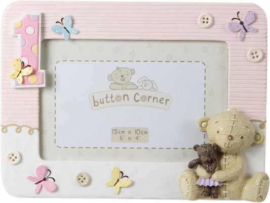 Children's photo frame with teddy bear and butterfly designs on a pink background