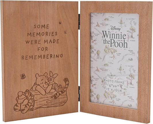 Wooden photo frame with engraved text and illustrations, featuring a map inside.