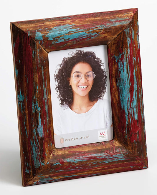 Wooden photo frame with a distressed finish holding a photo of a woman.