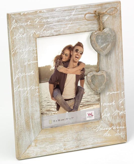 Wooden photo frame with heart decorations and a couple's photo inside