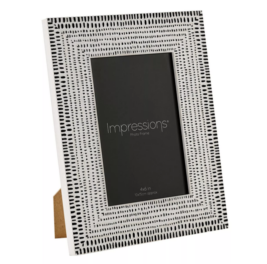Black and white patterned photo frame with 'Impressions' branding on a white background