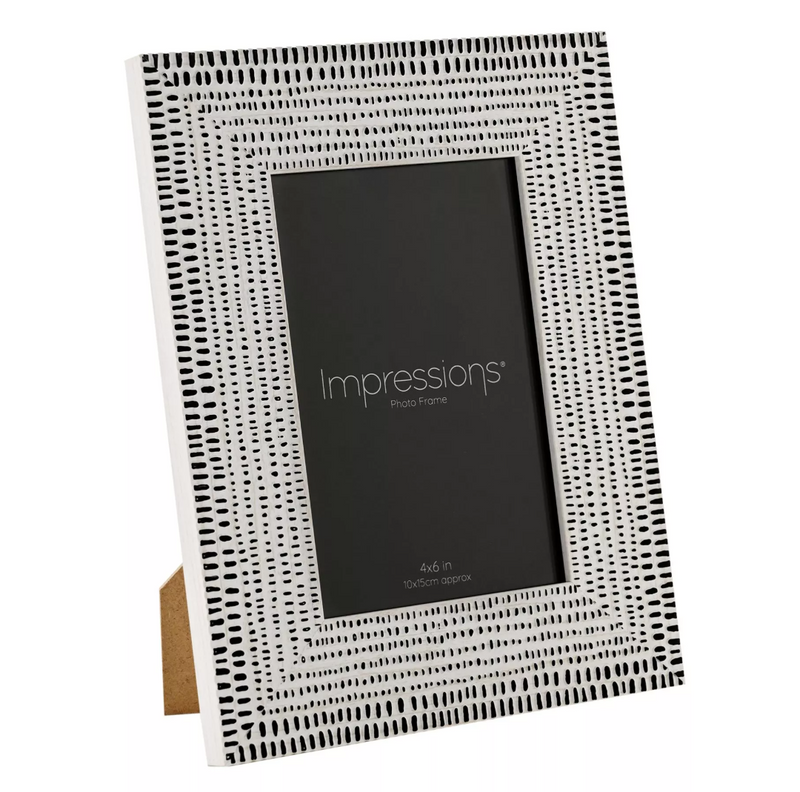 Black and white patterned photo frame with 'Impressions' branding on a white background