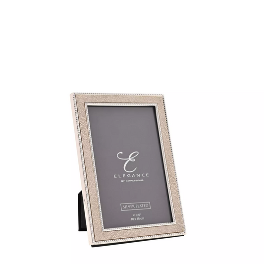 Silver photo frame with 'Elegance' branding on a white background