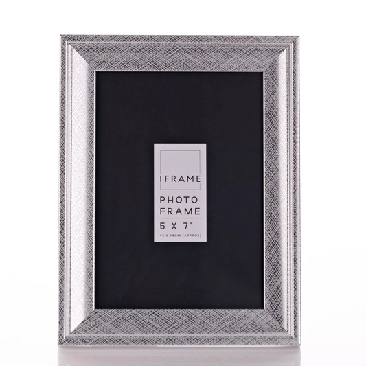 Silver photo frame with black mat on a white background