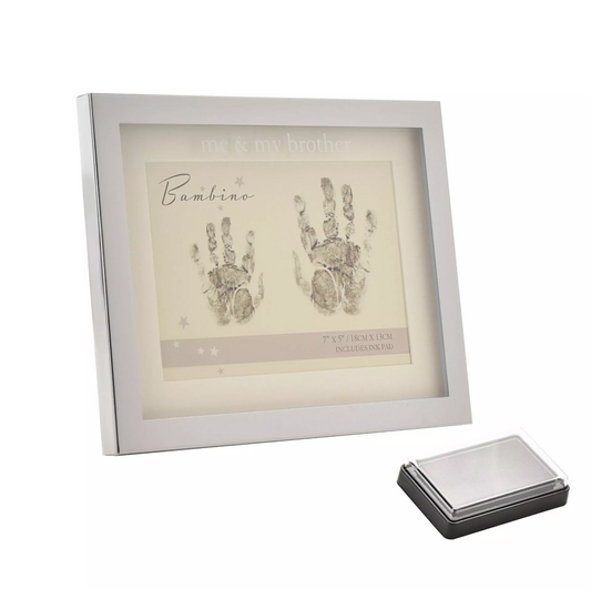 Framed print with handprints and text 'Bambino' on a white background