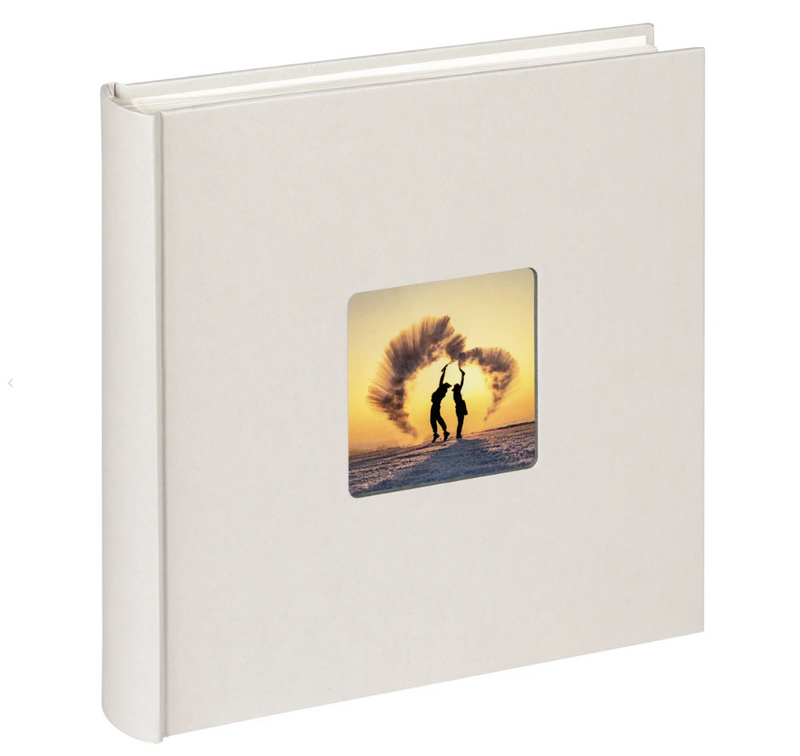 White photo album with a square window displaying a couple at sunset on a beach