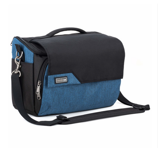 A blue and black messenger bag with a top handle, zippered compartments, and a detachable shoulder strap, shown on a plain white background.