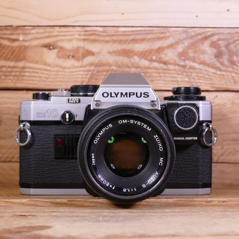 Used Olympus OM-10 Silver 35mm Film Camera Body with Manual Adapter and Zuiko 50mm F1.8 Lens