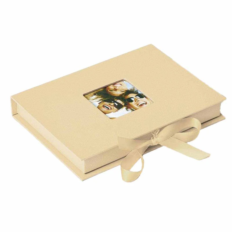 Beige photo album with a ribbon on a white background