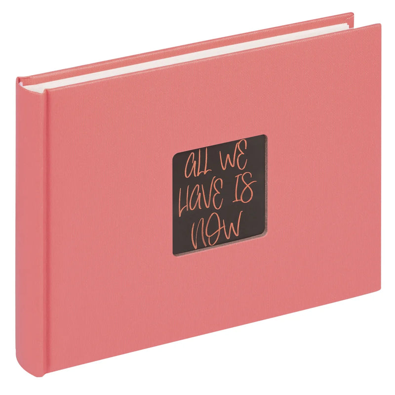Pink book with a black label on a white background