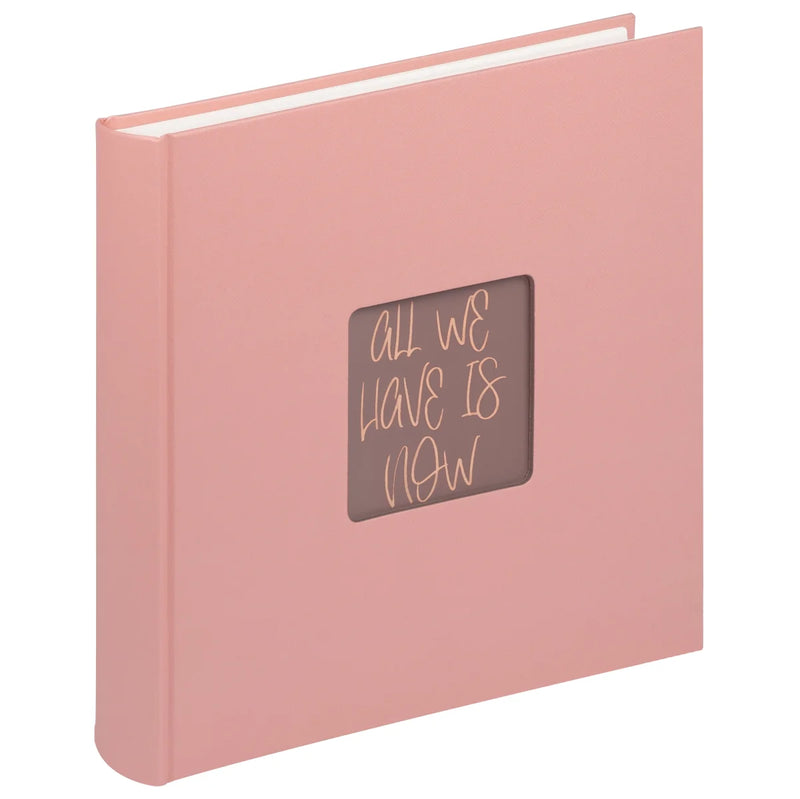 Pink book with a brown square on the cover featuring text, on a white background