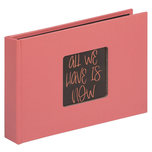 Pink album with a black label featuring the text 'All We Have Is Now' on a white background
